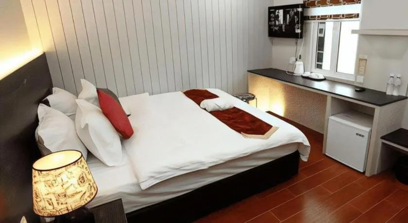 Bed in Grand SH Hotel