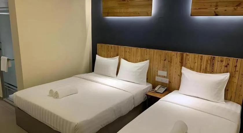 Bed in TLJ HOTEL
