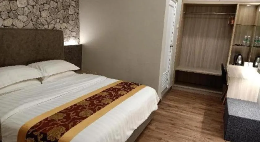 Bed in M GLOBAL HOTEL