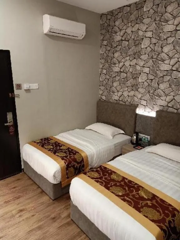 Bed in M GLOBAL HOTEL