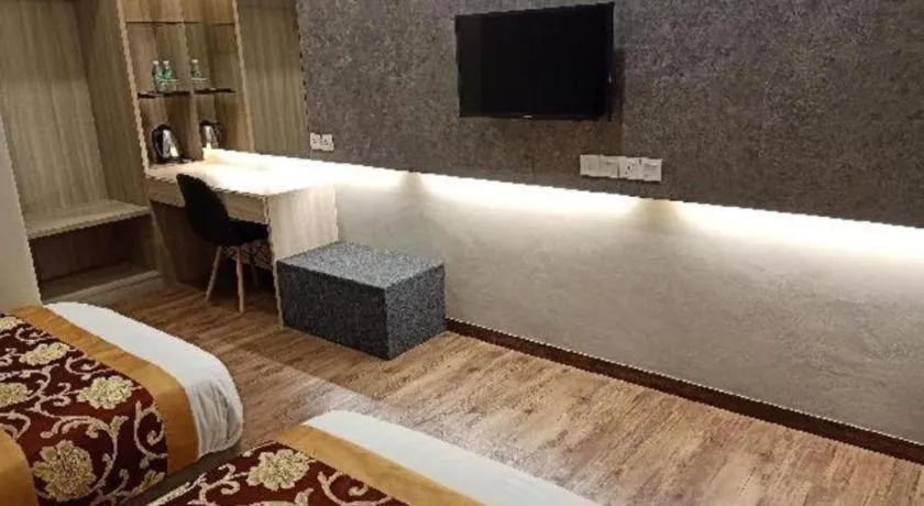 Bed in M GLOBAL HOTEL