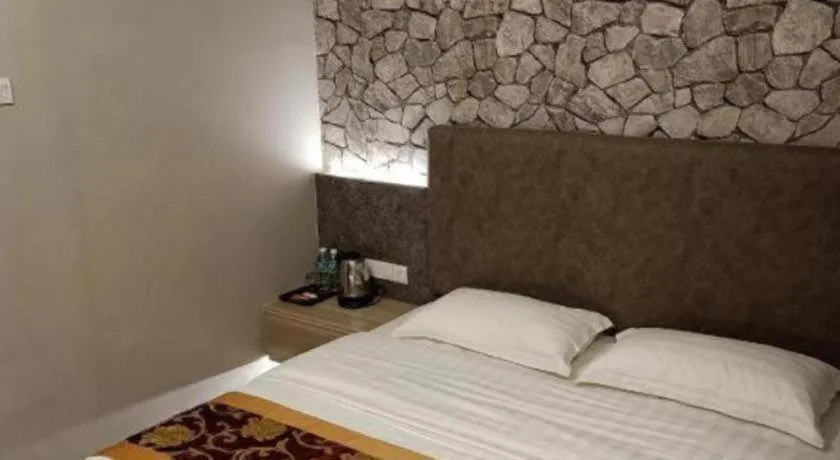 Bed in M GLOBAL HOTEL