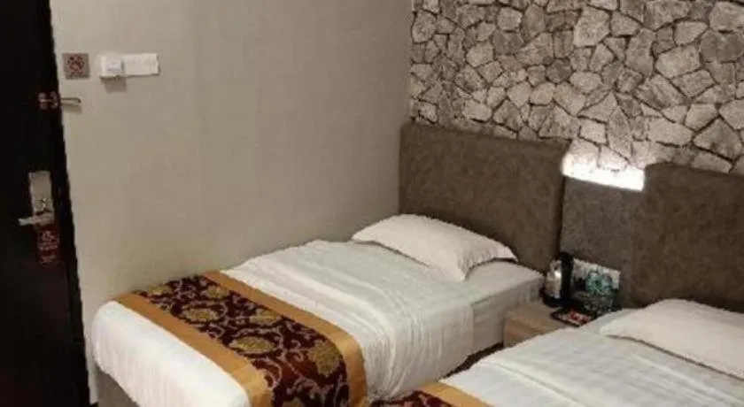 Bed in M GLOBAL HOTEL