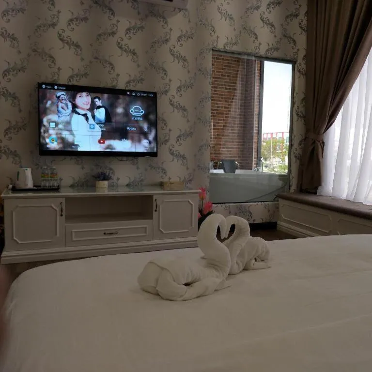 Bed in M GLOBAL HOTEL