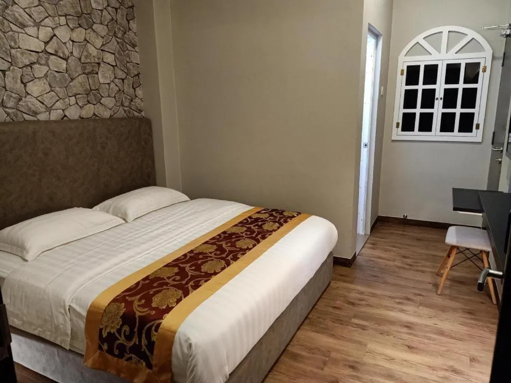 Bed in M GLOBAL HOTEL