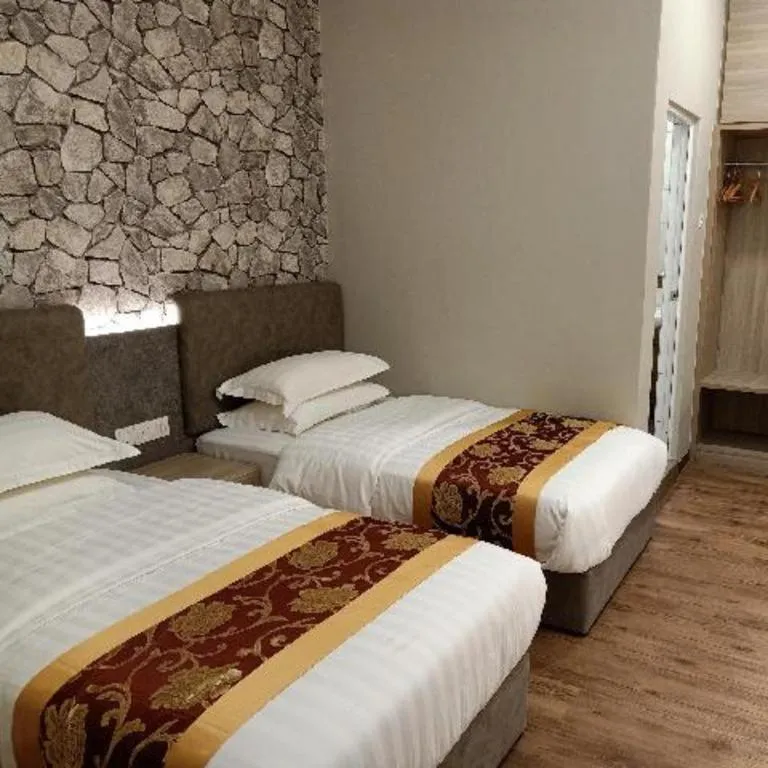 Bed in M GLOBAL HOTEL