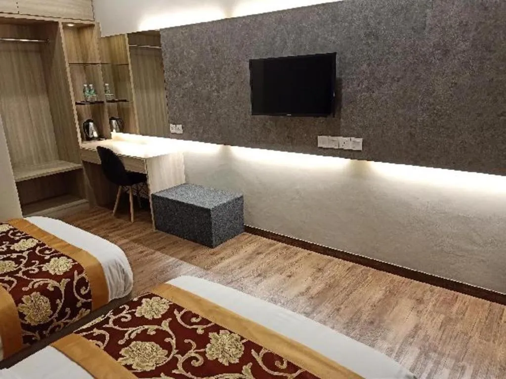 Bed in M GLOBAL HOTEL