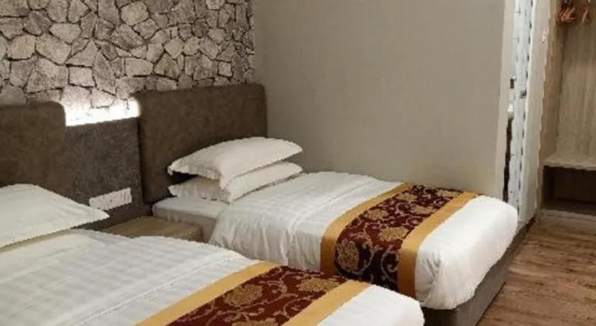 Bed in M GLOBAL HOTEL