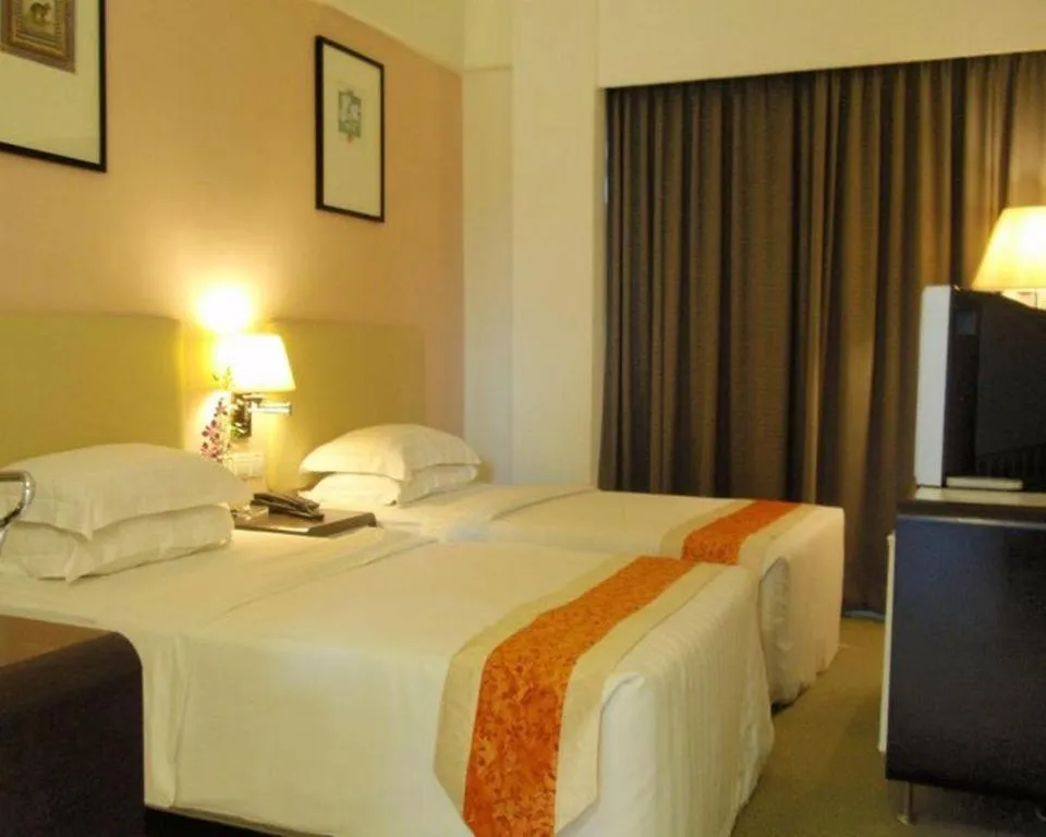 Bed in Ritz Garden Hotel