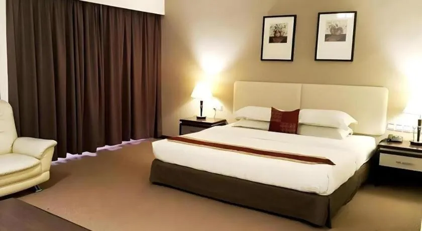 Bed in Ritz Garden Hotel