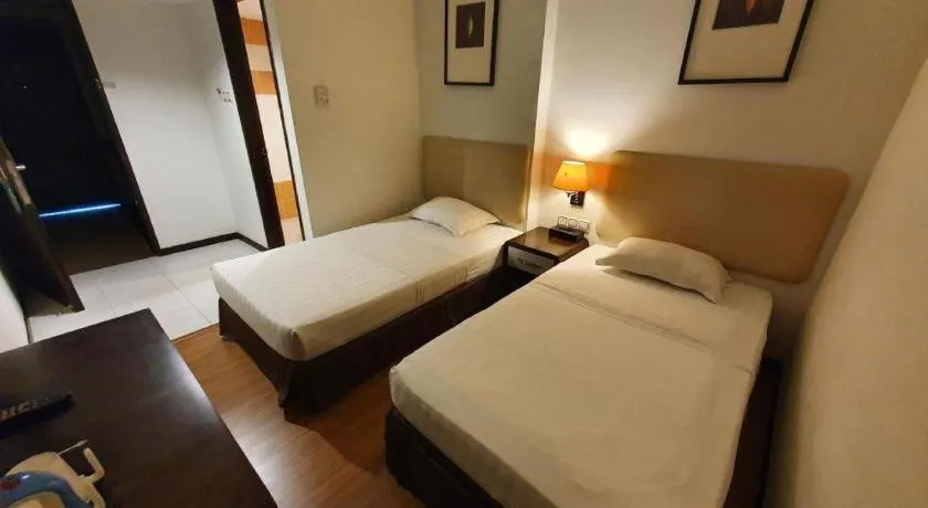 Bed in Ritz Garden Hotel