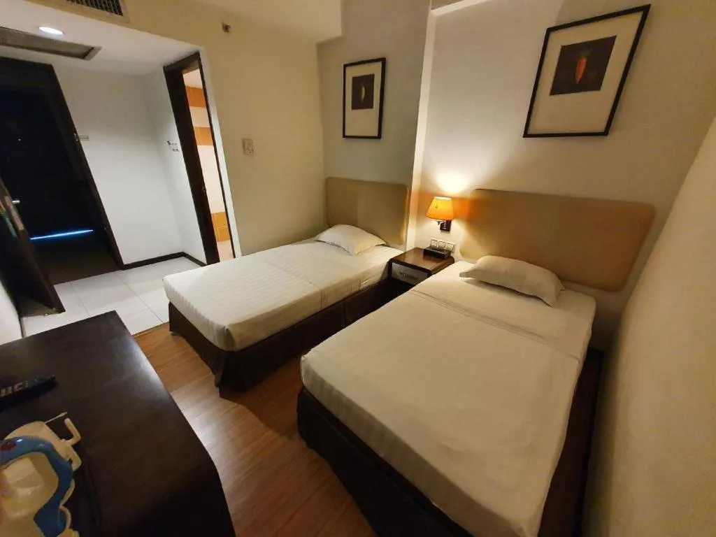 Bed in Ritz Garden Hotel