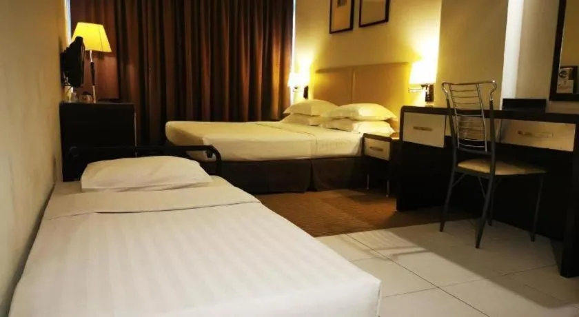 Bed in Ritz Garden Hotel