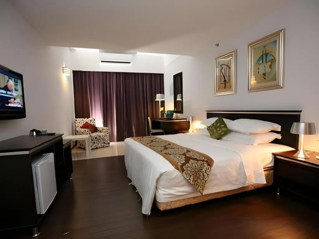 Bed in Ritz Garden Hotel