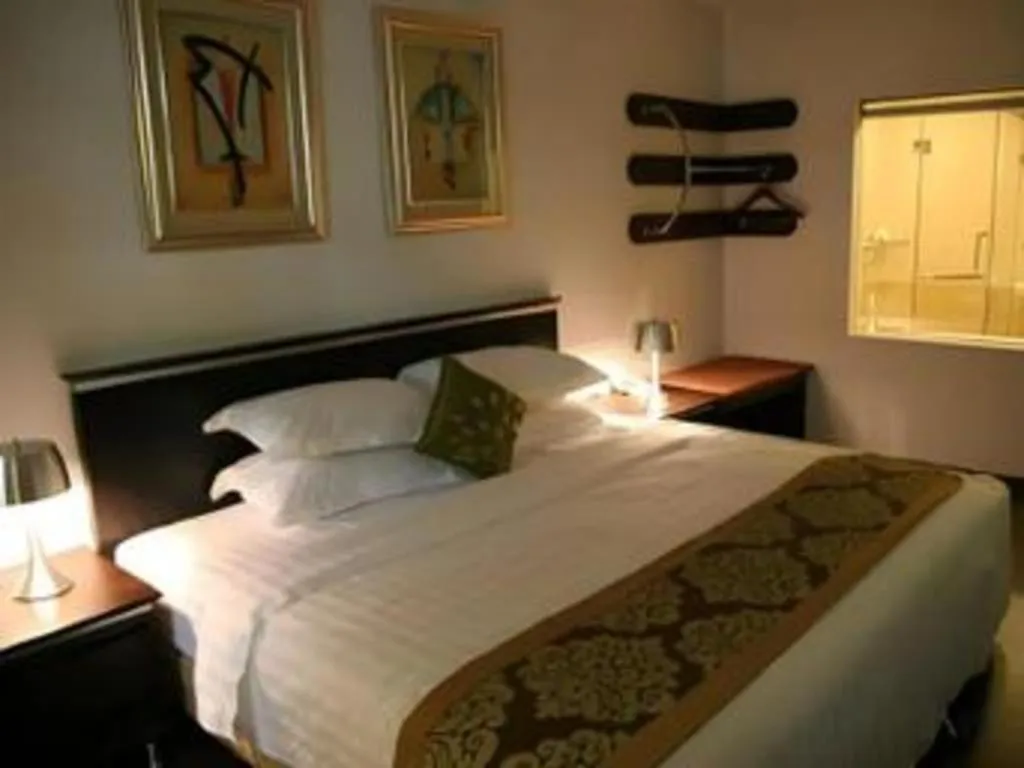 Bed in Ritz Garden Hotel