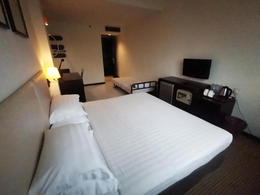 Bed in Ritz Garden Hotel