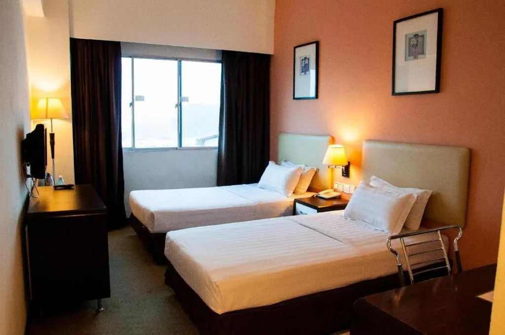 Bed in Ritz Garden Hotel