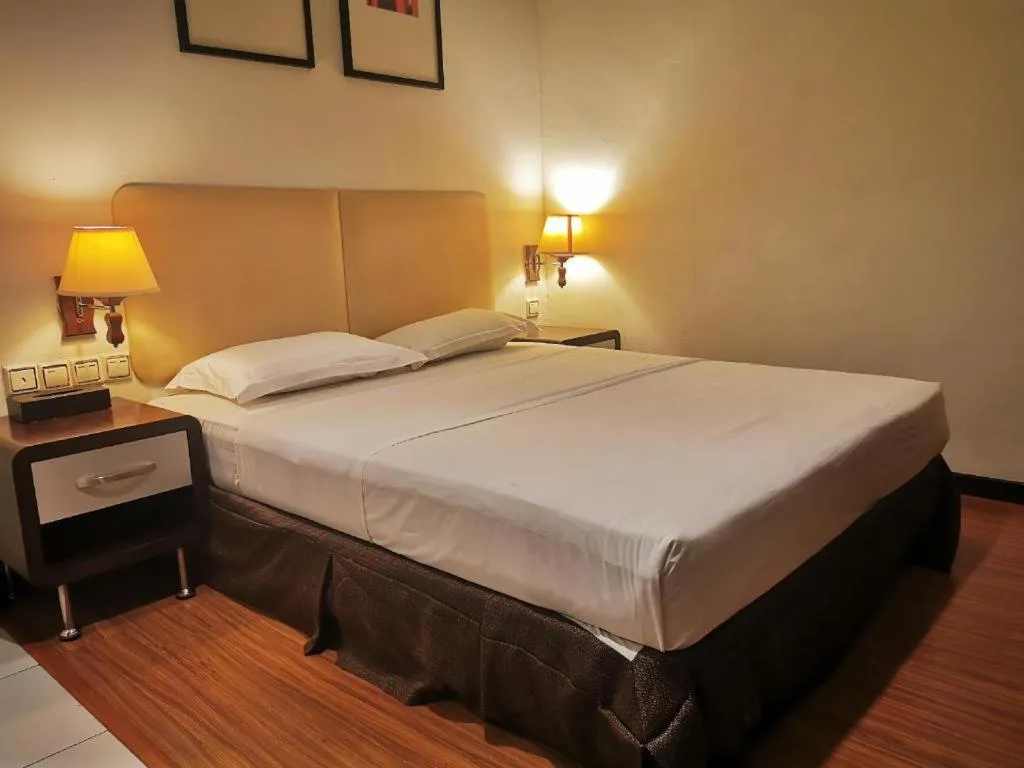 Bed in Ritz Garden Hotel