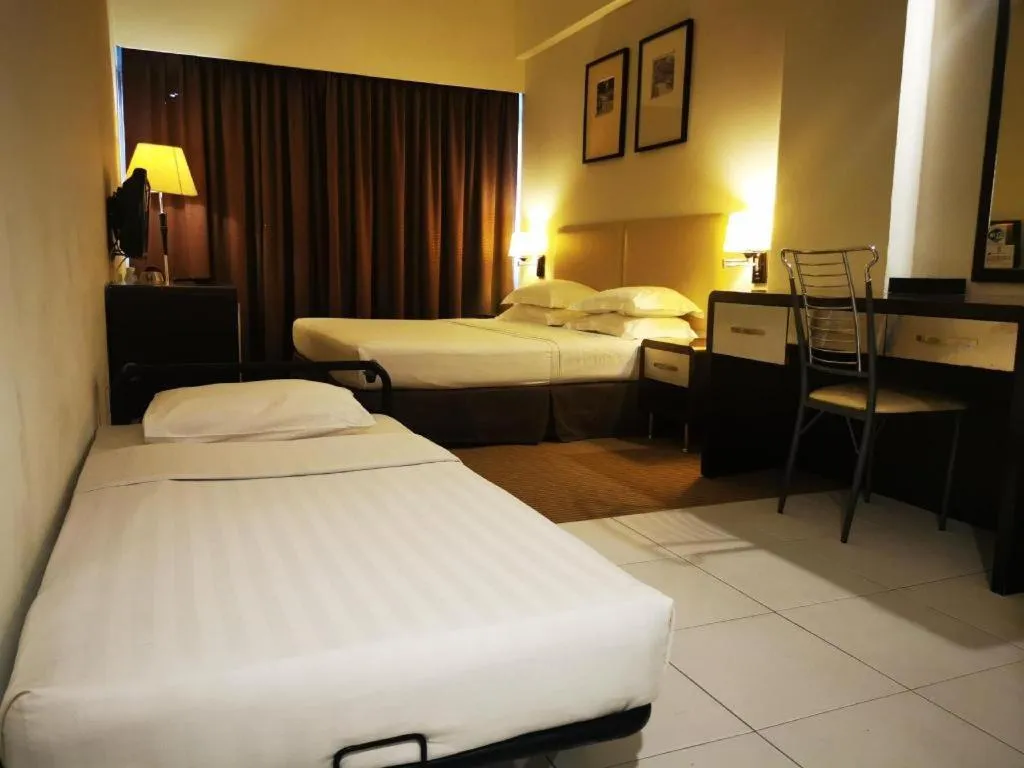 Bed in Ritz Garden Hotel