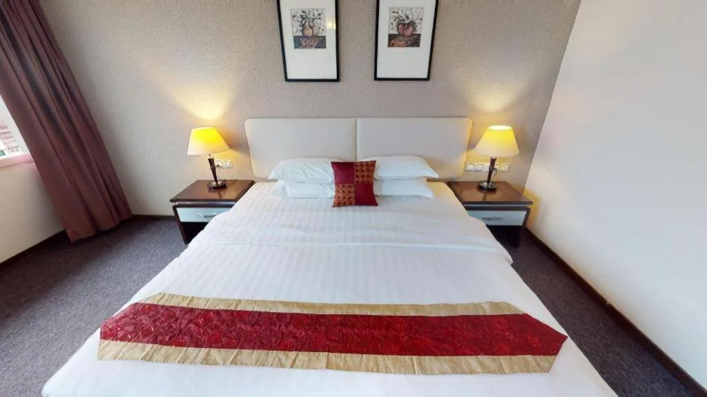 Bed in Ritz Garden Hotel