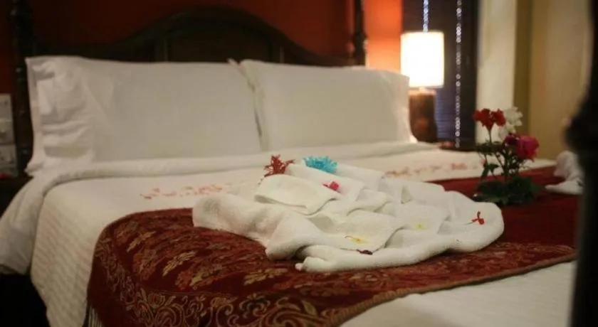 Bed in Anggun Boutique Hotel