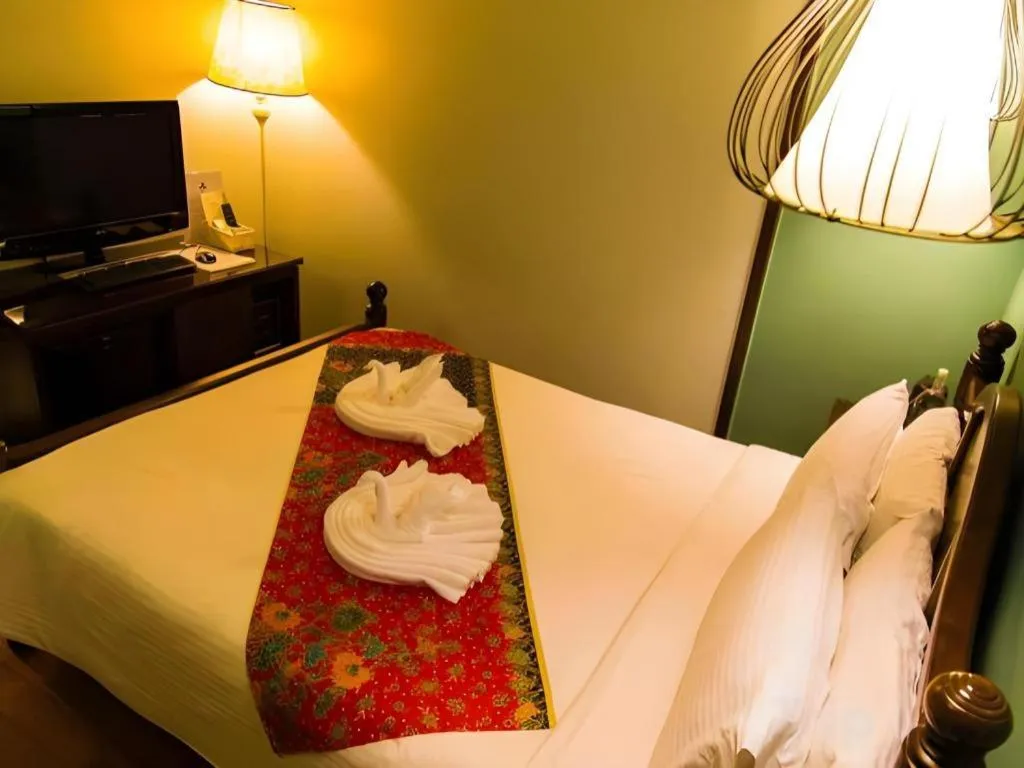 Bed in Anggun Boutique Hotel