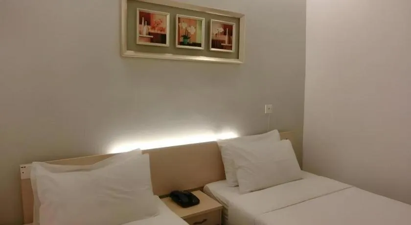 Bed in Paragon City Hotel