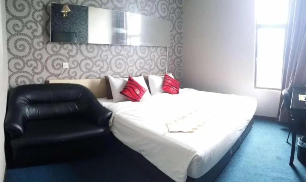 Bed in Paragon City Hotel