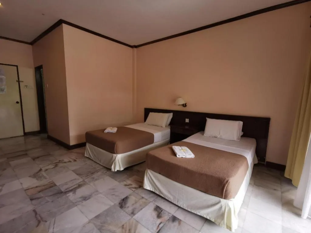 Bed in OYO 89972 Borneo Paradise Beach Hotel