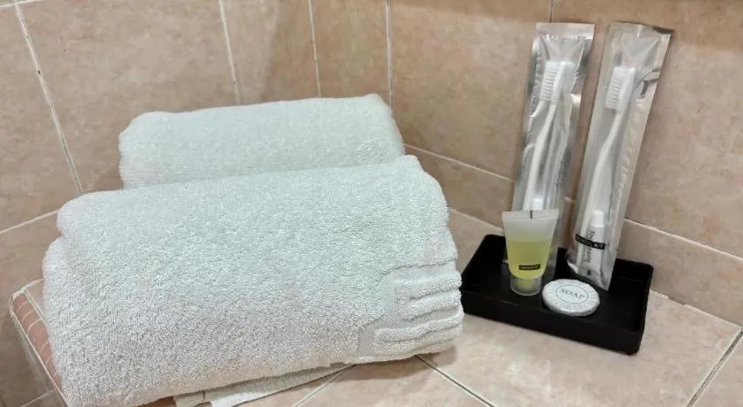 Bed in Putra Brasmana Hotel