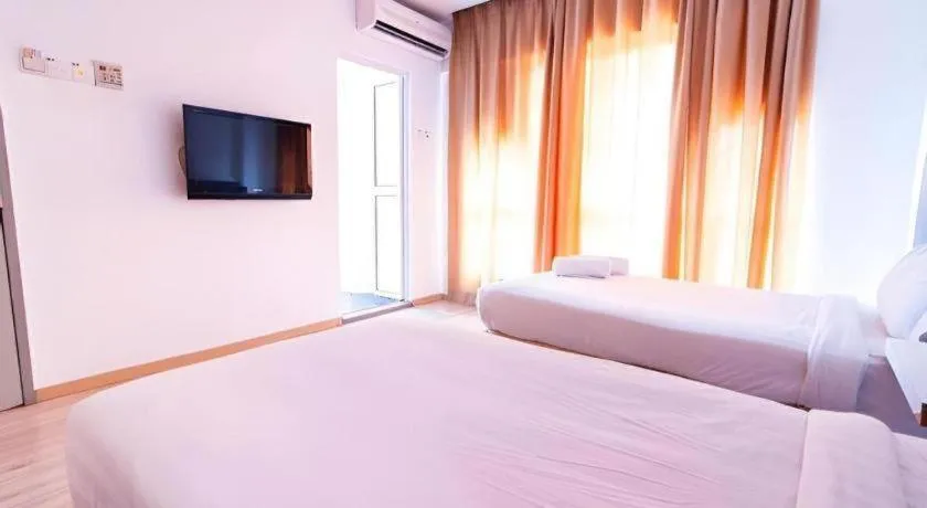 Bed in Hotel Zamburger Plaza Mahkota