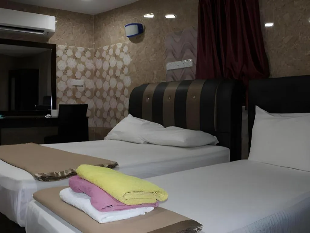 Bed in New Wave Hotel Melawati