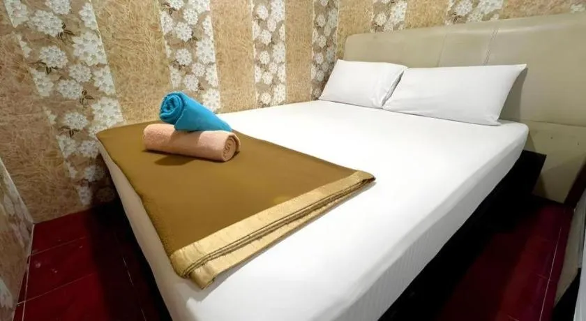 Bed in New Wave Hotel Melawati