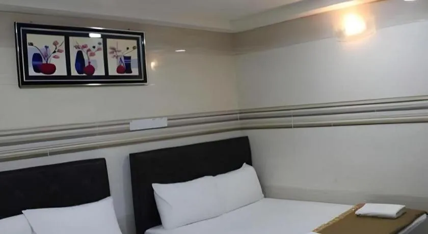 Bed in New Wave Hotel Melawati