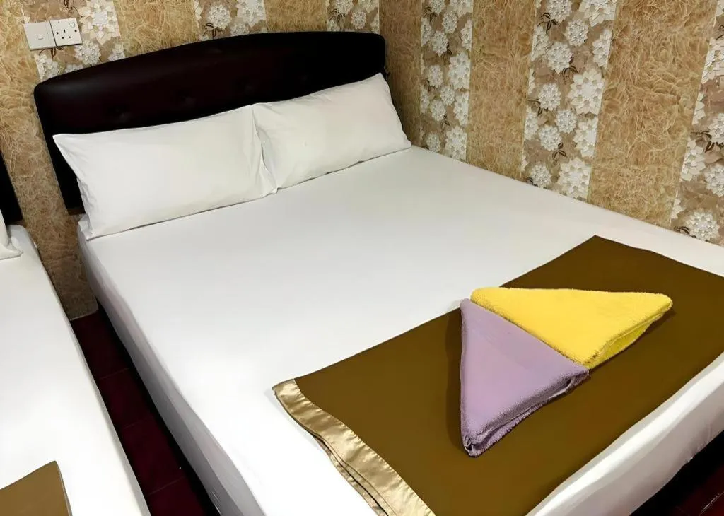 Bed in New Wave Hotel Melawati