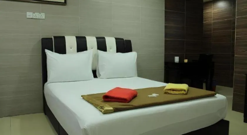 Bed in New Wave Hotel Melawati