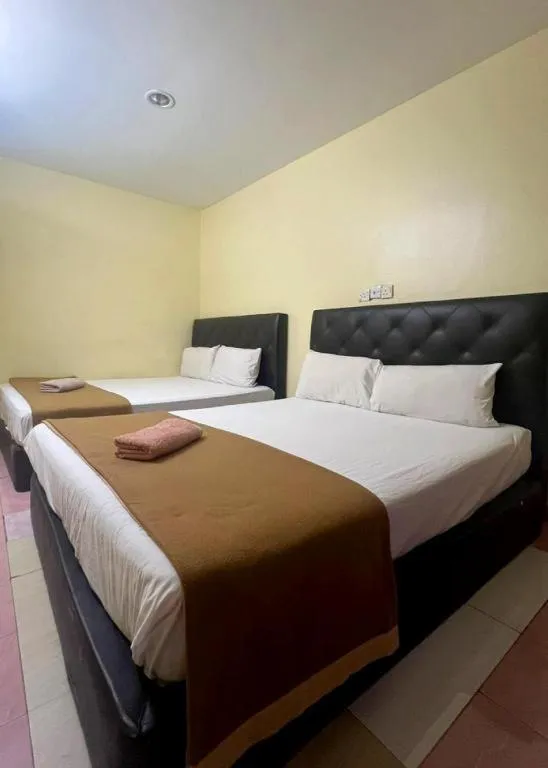 Bed in New Rawang Hotel