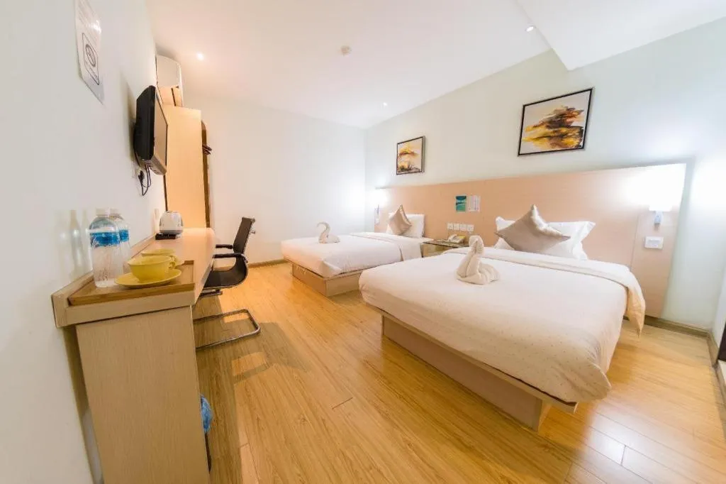 Bed in Hotel City Comfort Inn