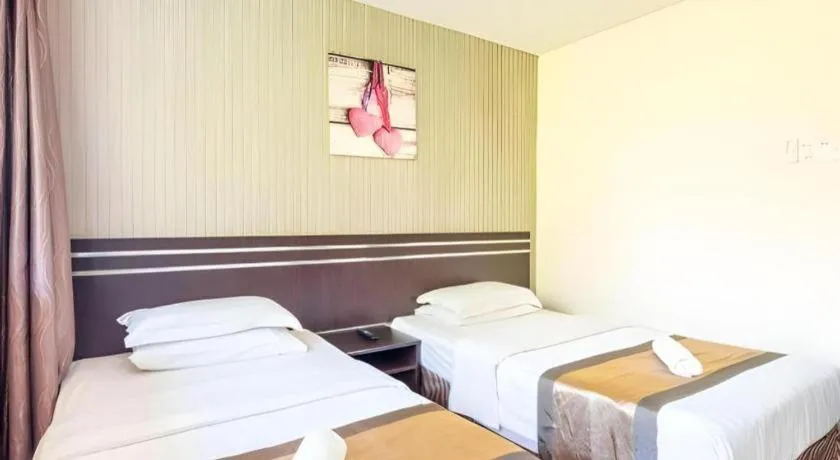 Bed in Goldenhill Hotel