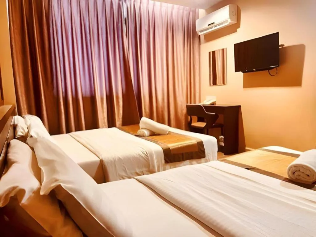 Bed in Goldenhill Hotel