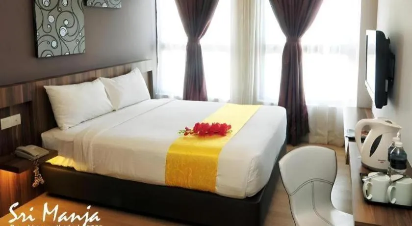 Bed in Sri Manja Boutique Hotel