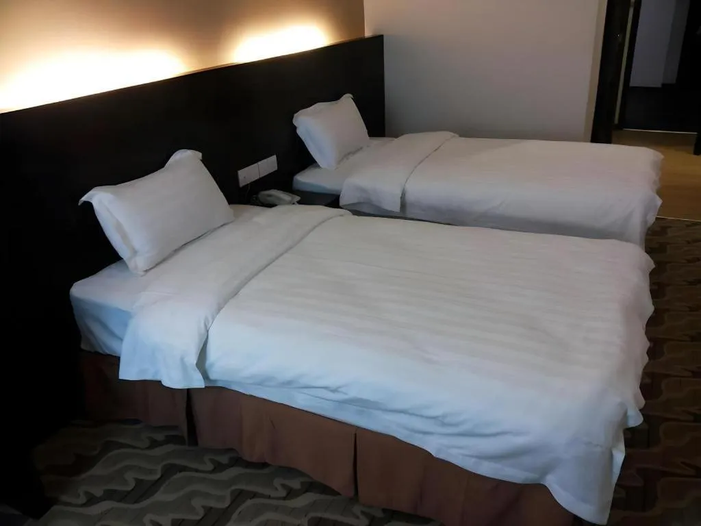 Bed in Eminent Hotel