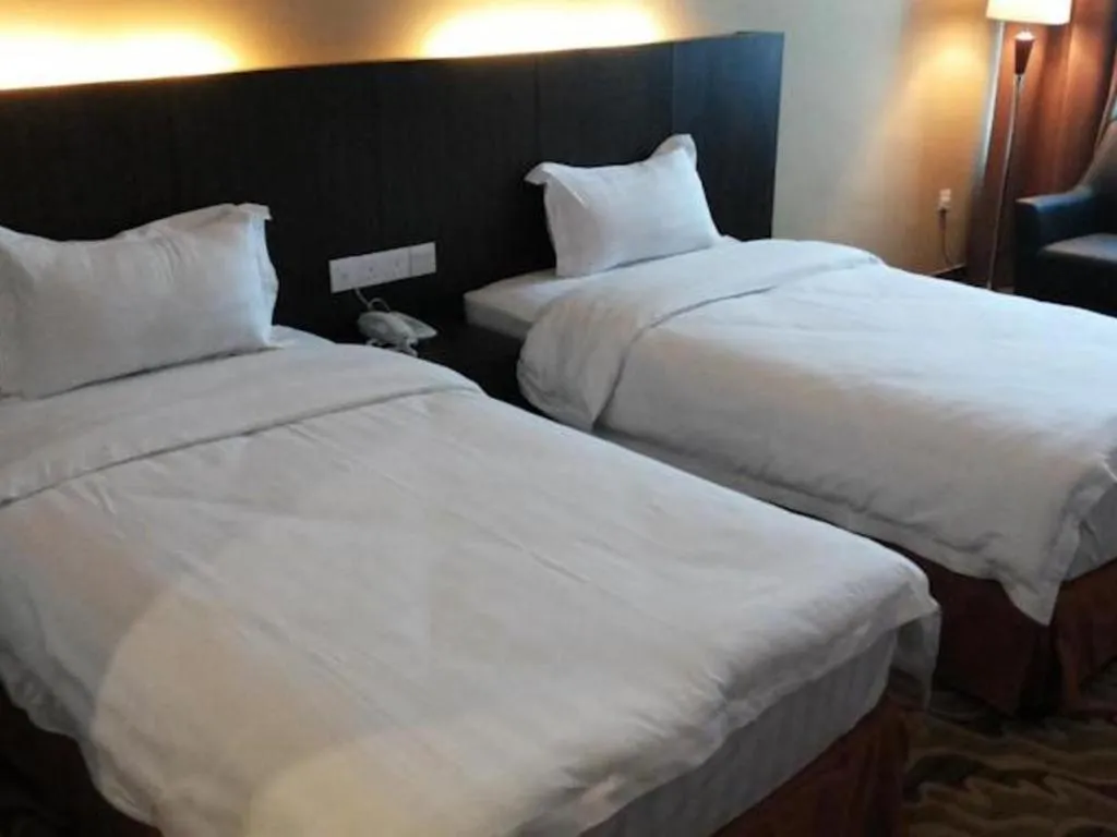 Bed in Eminent Hotel