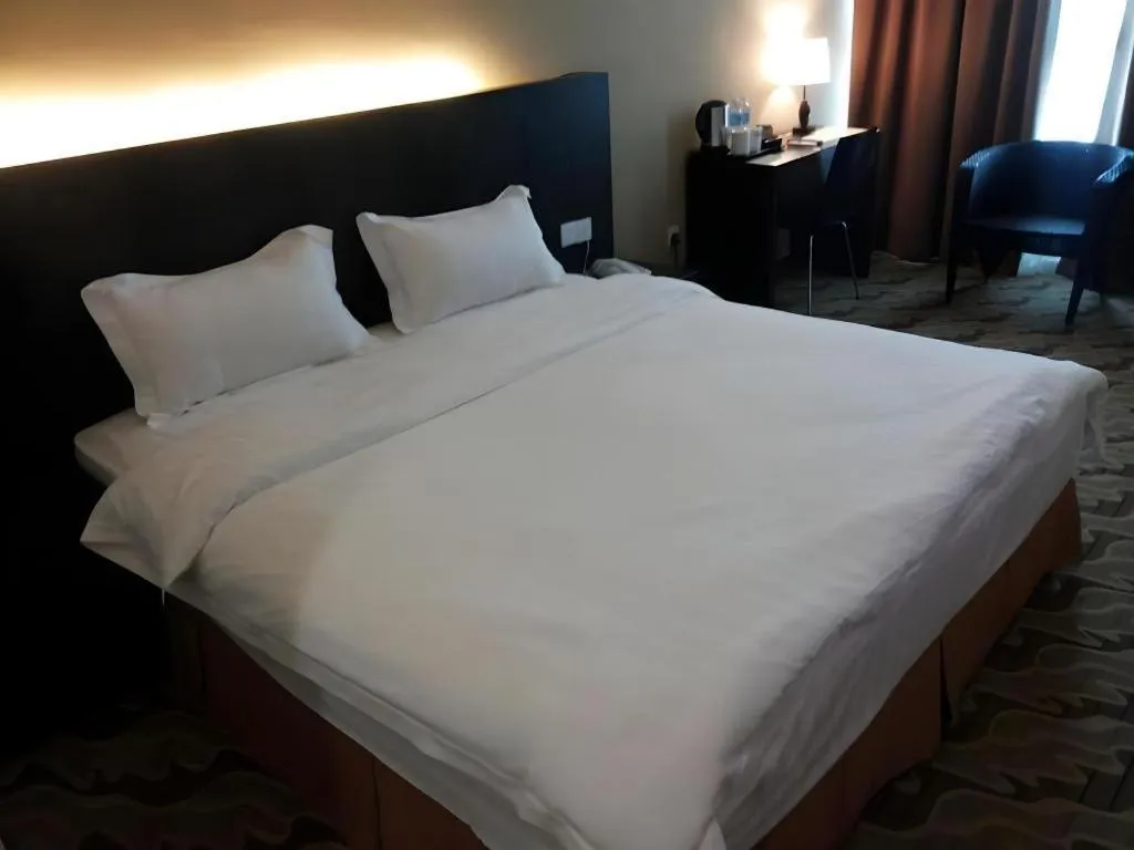 Bed in Eminent Hotel