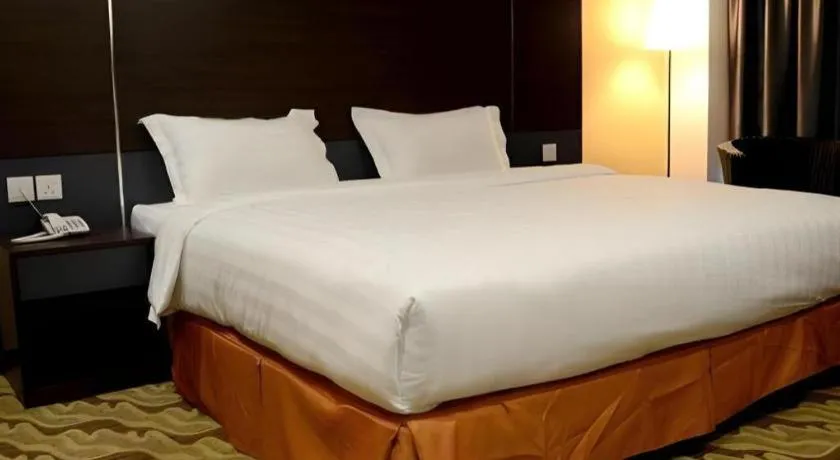 Bed in Eminent Hotel