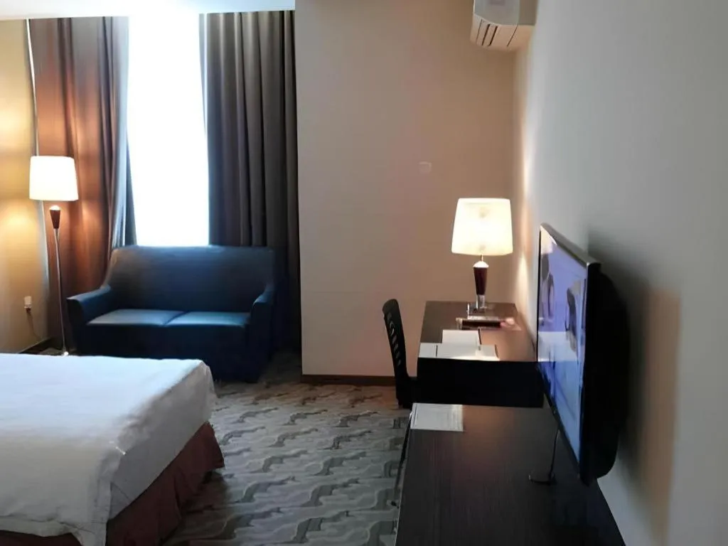 Bed in Eminent Hotel