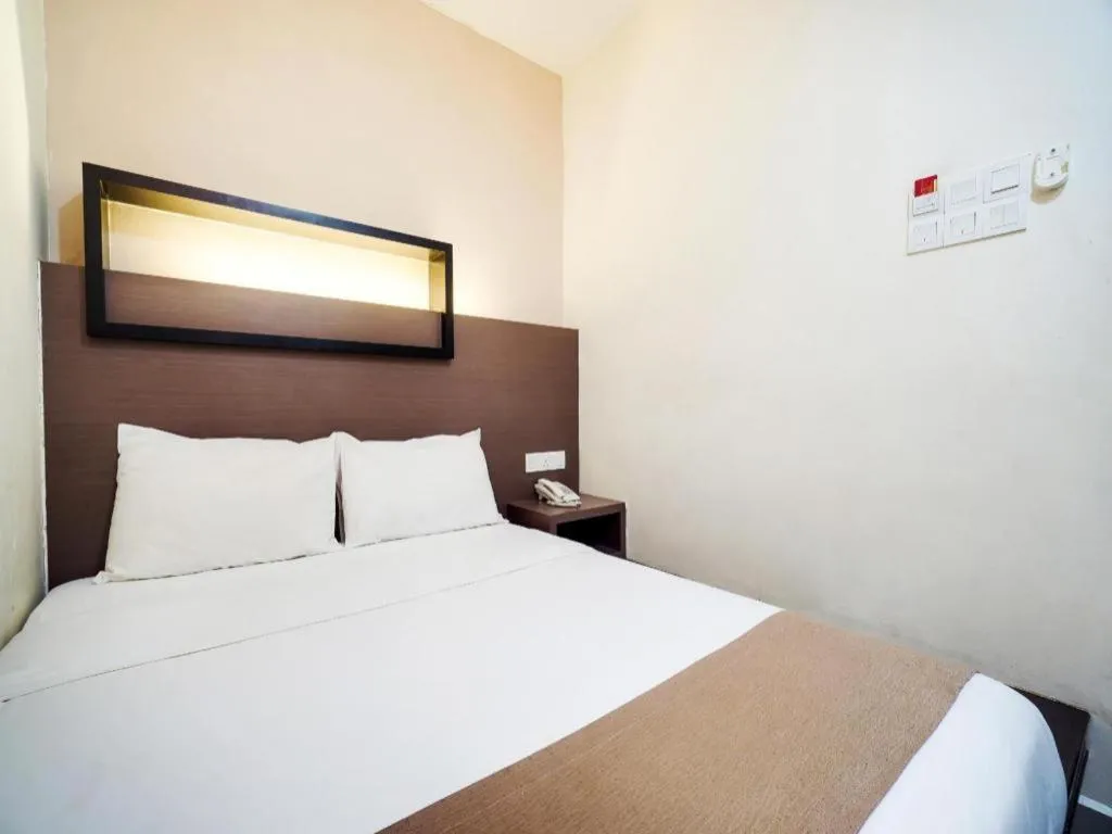 Bed in GM Holiday Hotel Permai Jaya