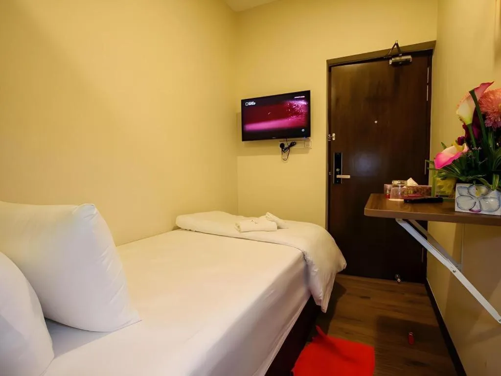 Bed in Tropicana Boutique Hotel