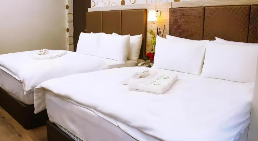 Bed in Tropicana Boutique Hotel