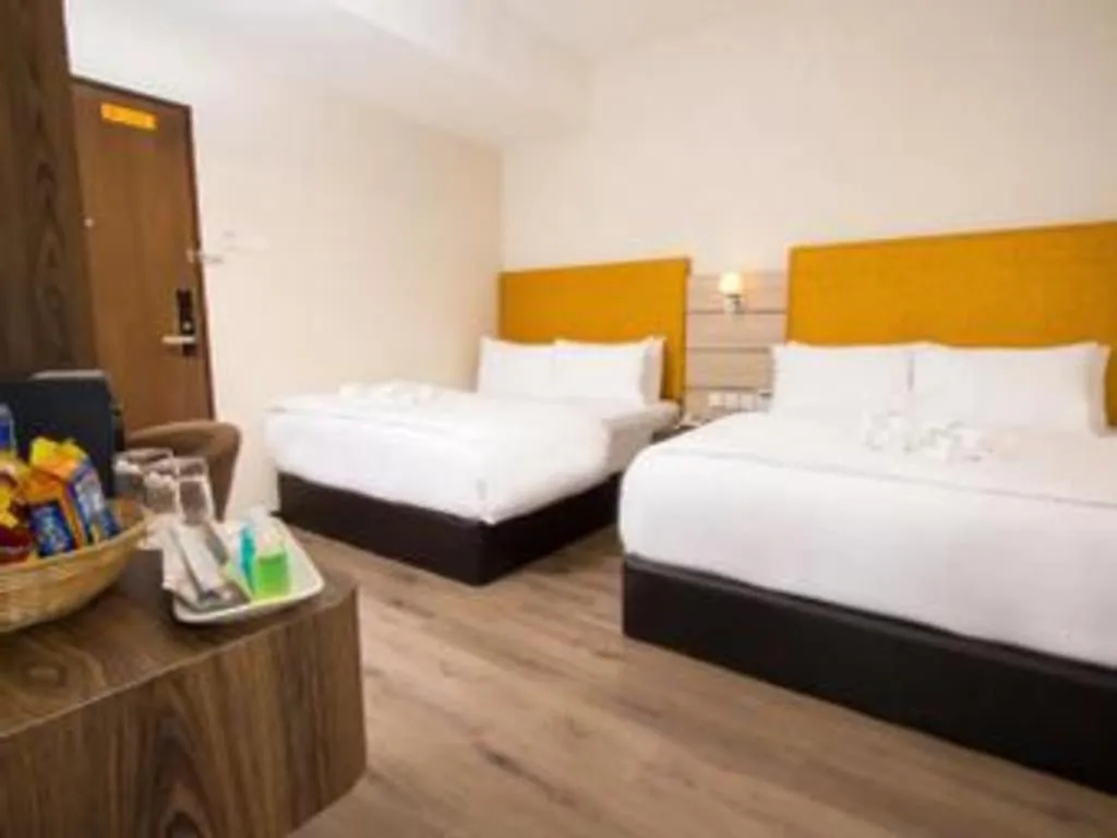 Bed in Tropicana Boutique Hotel